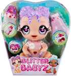 Amazon: Glitter Babyz Lila Wildboom Muñeca con 3 cambios de color mágicos, cabello morado y ropa con flores.