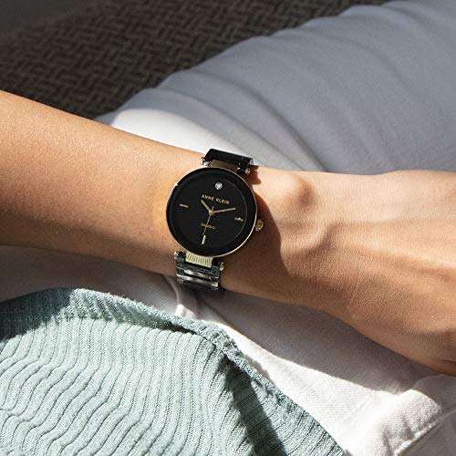 Amazon: Regalito para el 14 - Anne Klein Reloj de cerámica redondo, color negro diamond para mujer